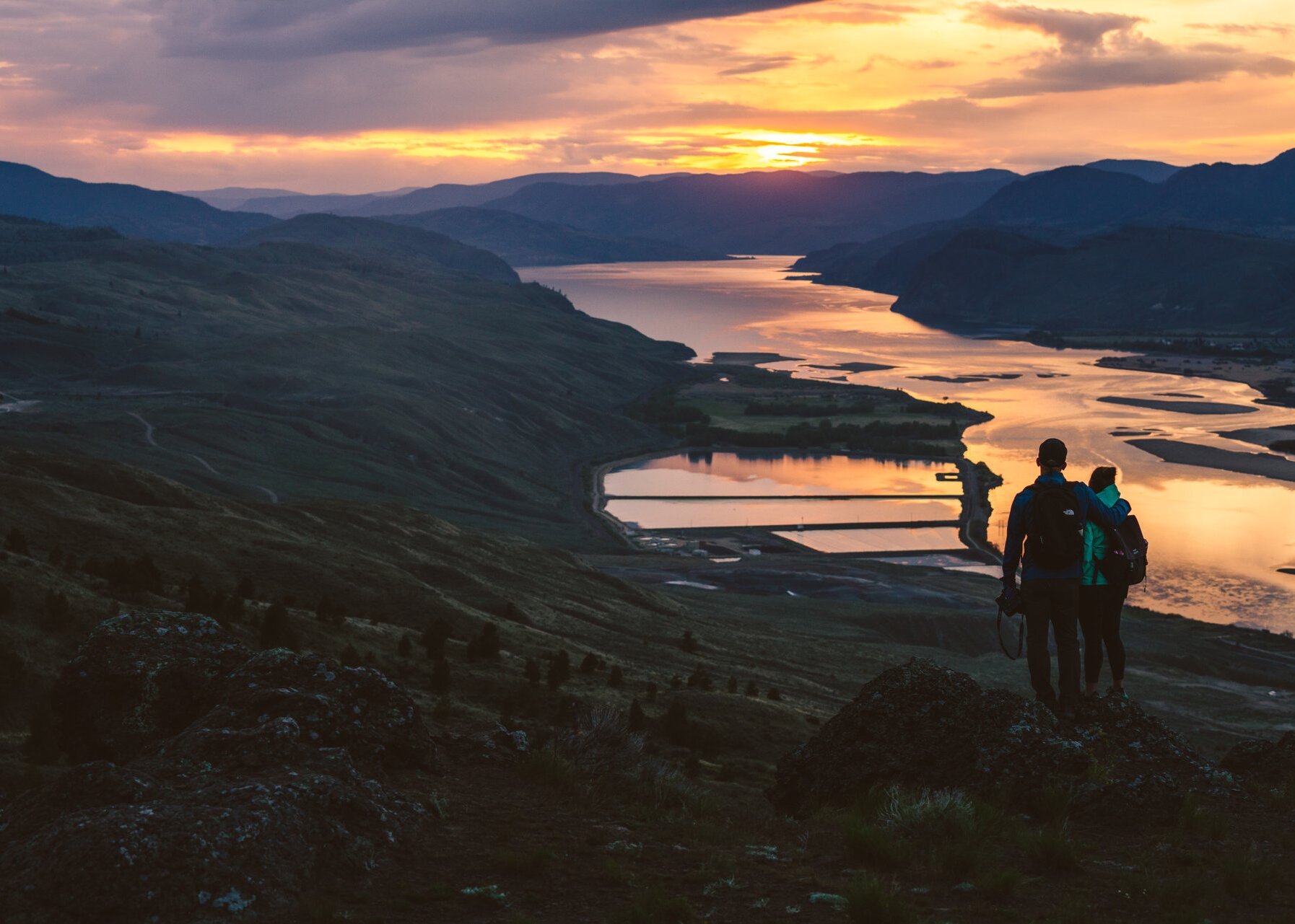 Group of Snowshoers admiring the view from Harper Mountain over the Thompson Valley in Kamloops, BC.